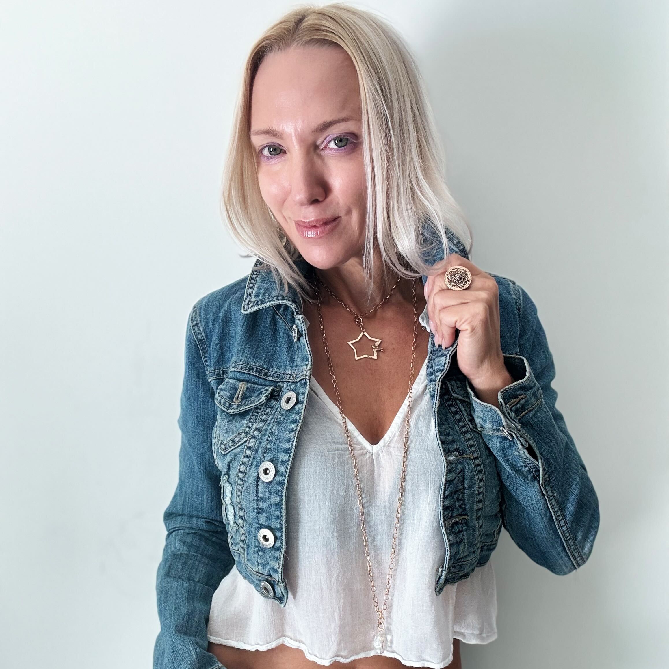 Katia Designs Peace & Love Star and Bird Original Lite Necklace in antique gold with delicate star and bird charms.