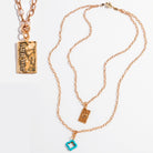 Katia Designs All Is Well Original Lite Necklace with antique gold finish and smoky crystal pendant, stylish and elegant jewelry piece.