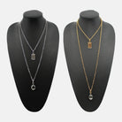 Katia Designs All Is Well Original Lite Necklace in antique gold with smoky crystal accents, delicate chain and elegant design.