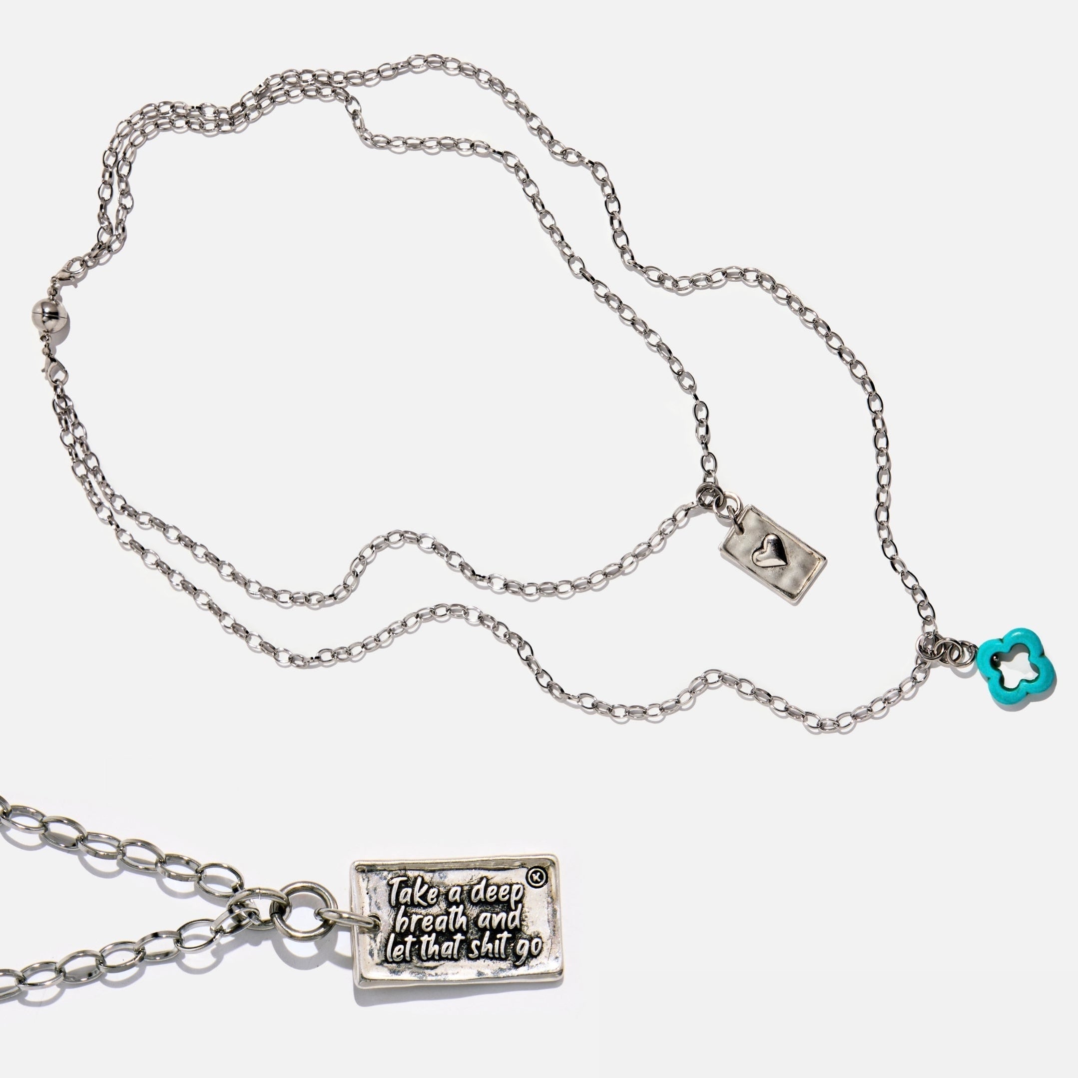 Katia Designs original Lite necklace with antique gold finish and smoky crystal, featuring "Take a Deep Breath and Let That Shit Go" pendant.