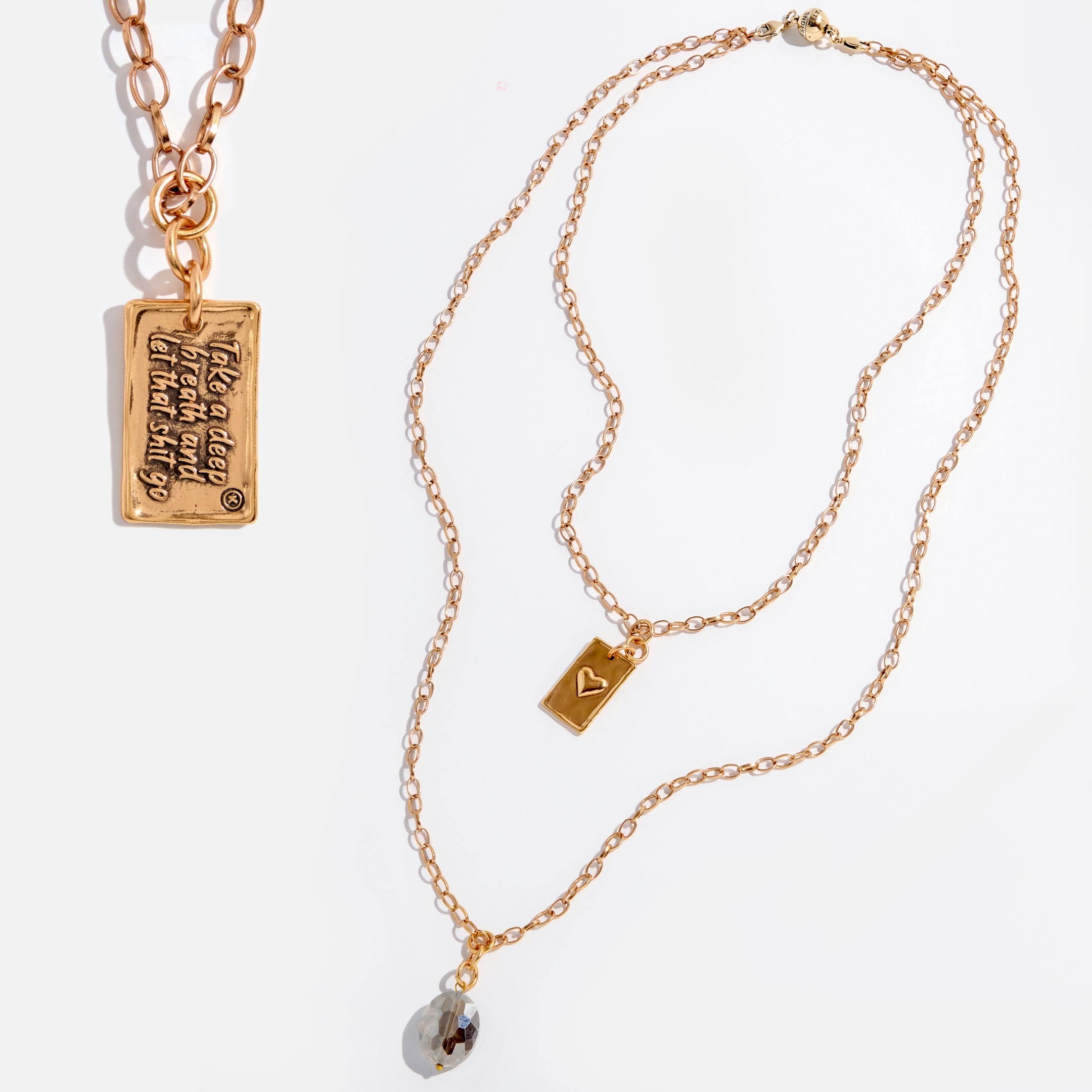 Katia Designs original lite necklace with antique gold finish and smoky crystal, featuring a calming "Take a Deep Breath" pendant.