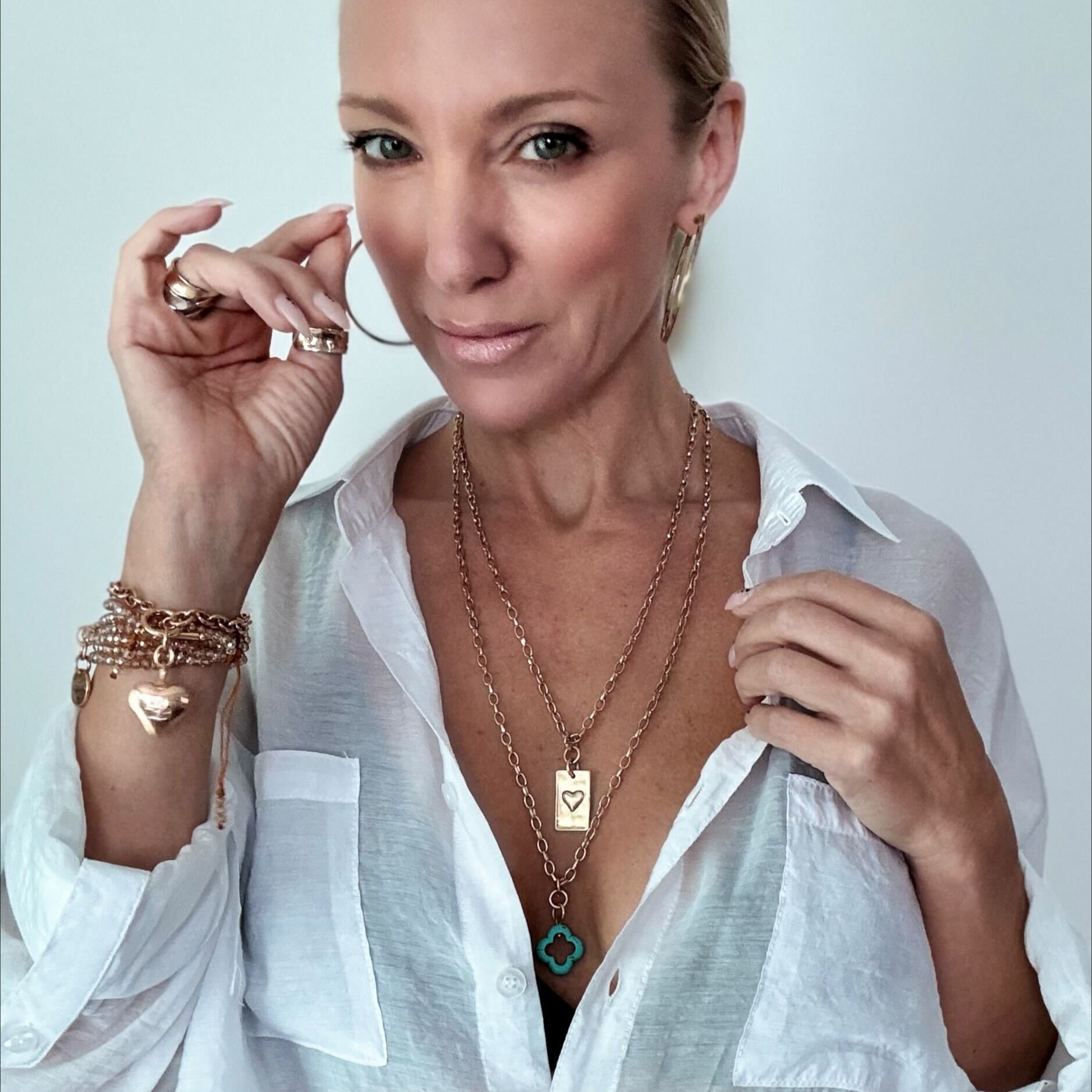 Katia Designs original Lite necklace with antique gold finish and smoky crystal, featuring engraved “Take a Deep Breath and Let That Shit Go.”
