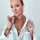 Katia Designs original lite necklace with smoky crystal, antique gold finish, featuring the "Take a Deep Breath and Let That Shit Go" pendant.
