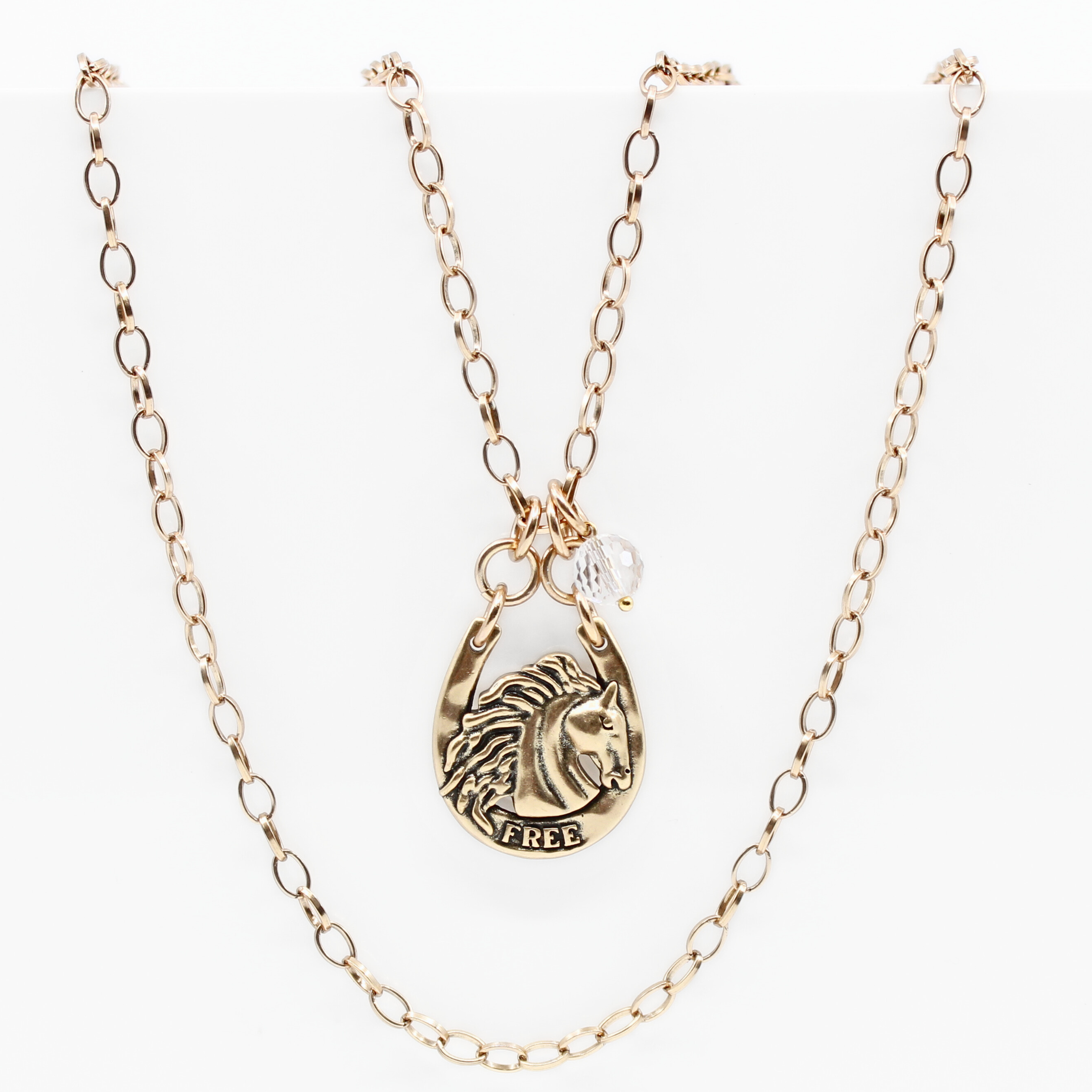 Katia Designs Wild & Free Horse Original Lite Necklace in antique gold featuring a detailed horse pendant on a delicate chain.