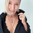 Katia Designs All is Well Clover Original Lite silver necklace with smoky crystal pendant on a delicate chain.