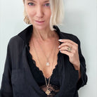 Katia Designs All is Well Clover Original Lite necklace with silver chain and smoky crystal charm on a delicate chain.