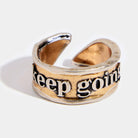 Katia Designs Keep Going Remember adjustable ring with engraved inspirational message, silver-tone band, and adjustable fit.
