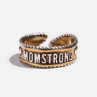Katia Designs MomStrong adjustable ring with a sleek band, featuring engraved text and a modern, stylish design.
