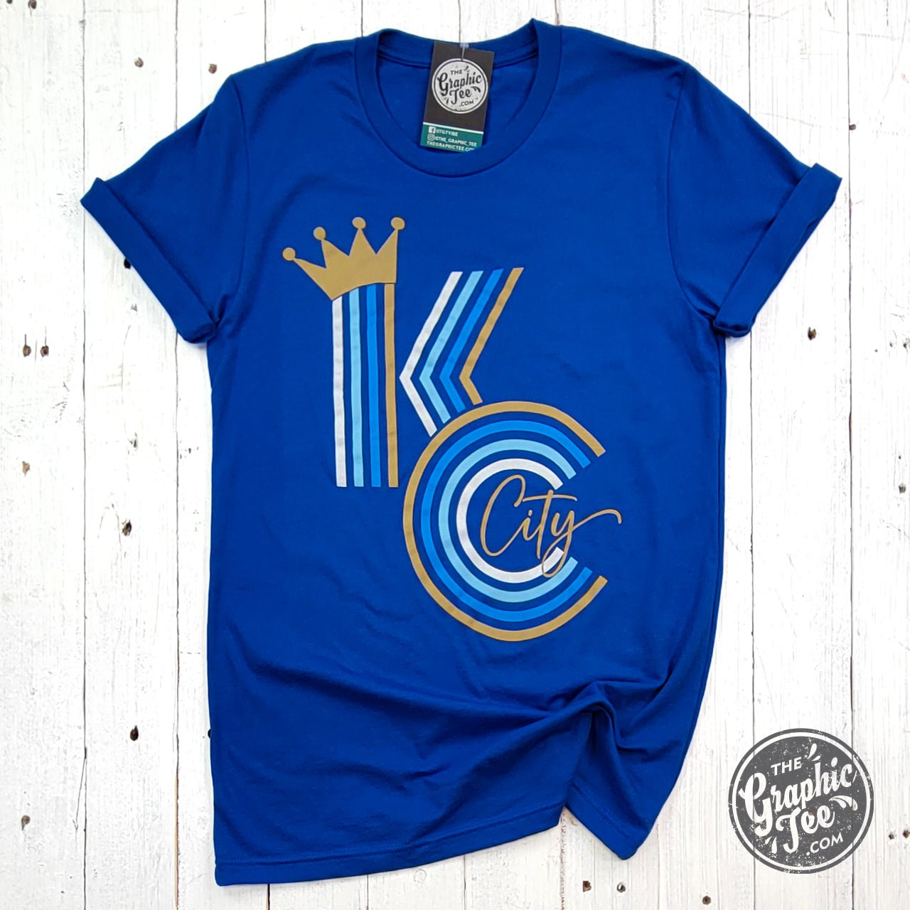 Royal blue KC Crown Ombre Short Sleeve Tee by The Graphic Tee, featuring a graphic crown design with gradient ombre effect.