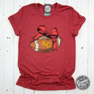 Heather cardinal short sleeve crewneck tee with KC football bow graphic by The Graphic Tee, casual athletic-inspired design.