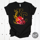 Black short sleeve graphic tee by The Graphic Tee featuring a KC football with helmet design.
