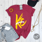 Red unisex short sleeve graphic tee from The Graphic Tee featuring KC Laces design and casual fit.