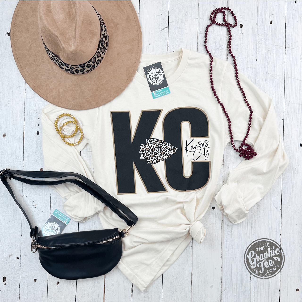KC Leopard Natural Heather long sleeve graphic tee by The Graphic Tee, featuring leopard print design on soft heather fabric.