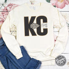 KC Leopard Natural Heather Long Sleeve Graphic Tee by The Graphic Tee featuring a stylish leopard print design on soft long sleeves.