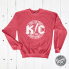 KC Rock crewneck sweatshirt from The Graphic Tee featuring a classic graphic design on soft, comfortable fabric.