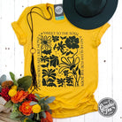 Heather golden yellow short sleeve graphic tee by The Graphic Tee featuring uplifting "Kind Words" design on soft cotton fabric.