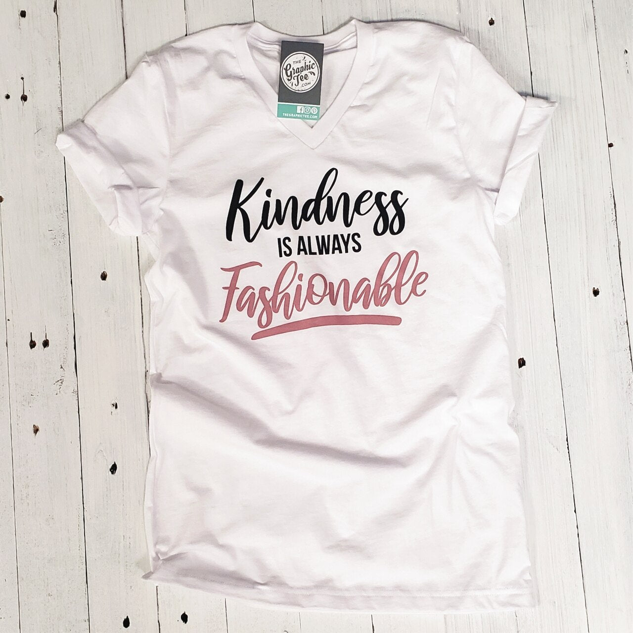 Gray V-neck graphic tee from The Graphic Tee with the phrase "Kindness is Always Fashionable" printed on the front.
