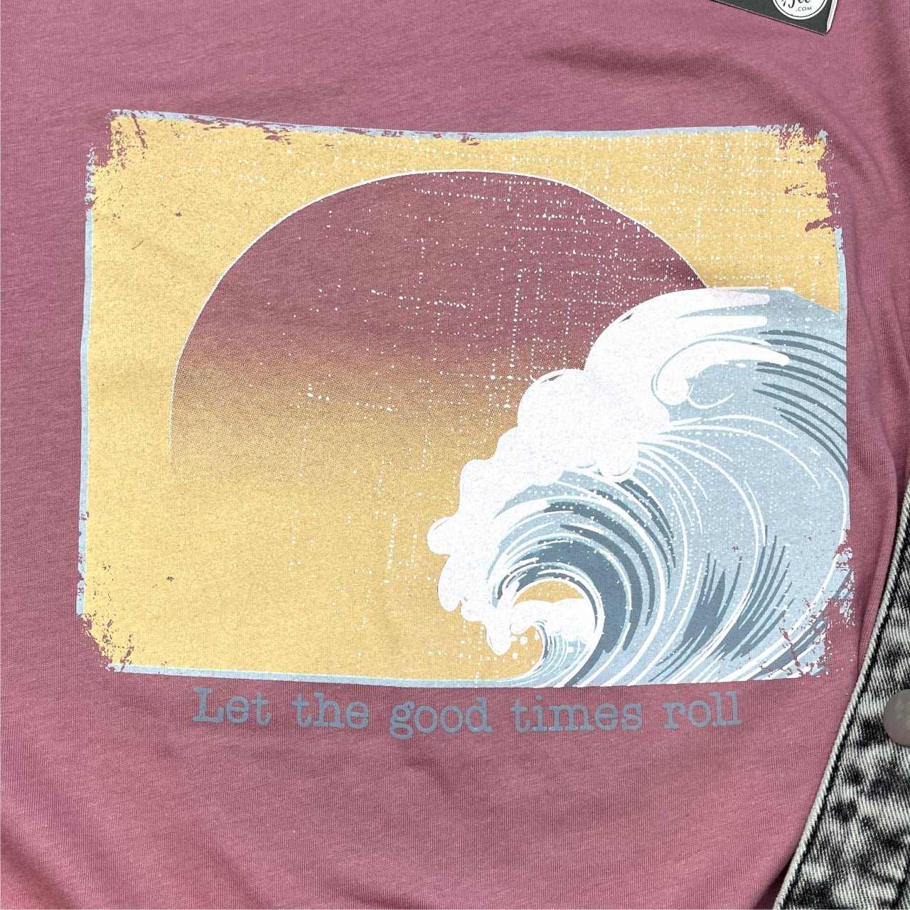 White short-sleeve graphic T-shirt from The Graphic Tee with "Let The Good Times Roll" print on the front.