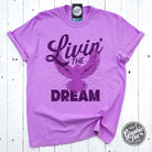 Livin' the Dream Neon Violet Graphic Tee by The Graphic Tee, short sleeve pigment-dyed t-shirt with vibrant color and graphic design.