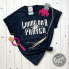 Black mineral wash crew neck short sleeve graphic tee by The Graphic Tee featuring "Living On A Prayer" design.