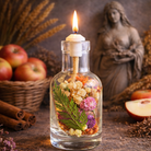 Hestia oil candle by Logos Candles with a sleek glass holder and lit wick, creating a warm, ambient glow.