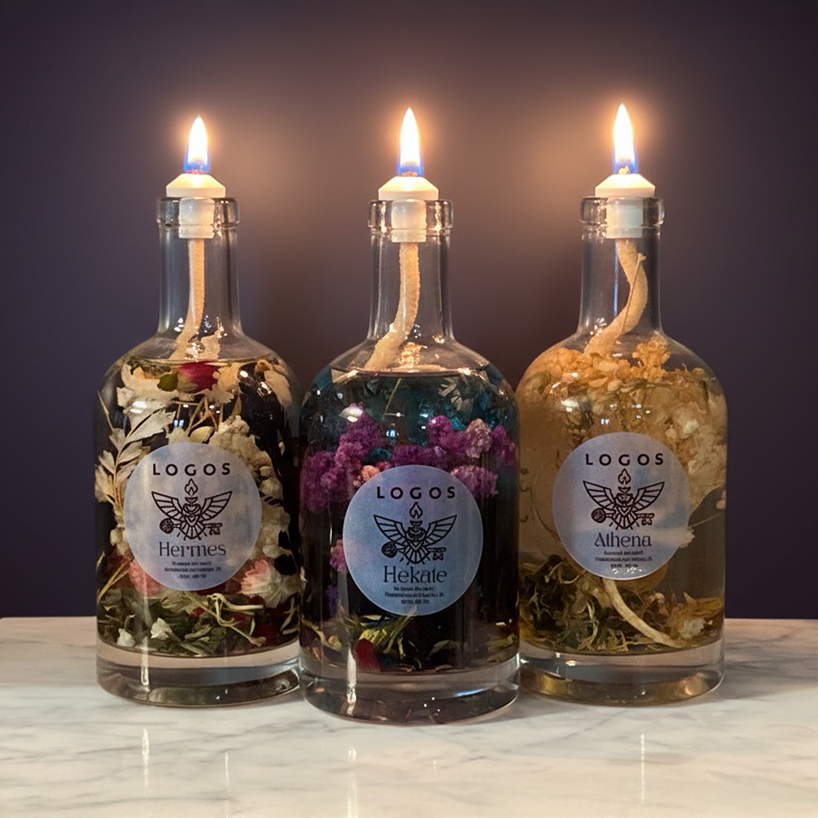 Oracle Trio candle set by Logos Candles featuring three elegantly designed scented candles in decorative glass containers.