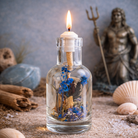 Logos Candles Poseidon oil candle with a decorative container and a lit wick, ideal for ambient lighting and relaxation.