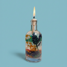 Uranus oil candle by Logos Candles featuring a celestial-themed design on a glass container with a wick for aromatic lighting.