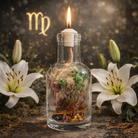 Virgo oil candle by Logos Candles with a decorative glass holder and a lit wick, designed for ambient lighting and home decor.