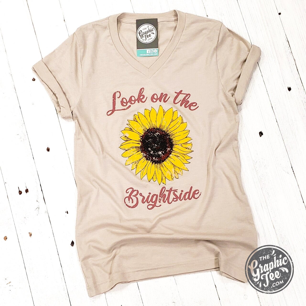 Bright yellow V-neck graphic tee from The Graphic Tee, featuring a positive message on a casual short-sleeve shirt.