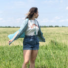 Vintage Love One Another SS Graphic Tee by The Graphic Tee, featuring a colorful printed design on a casual cotton T-shirt.
