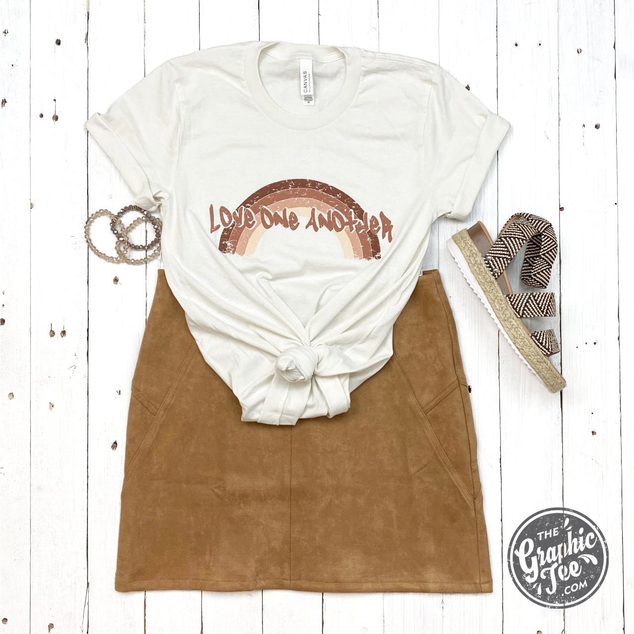 Vintage Love One Another SS Graphic Tee by The Graphic Tee featuring a colorful, retro-inspired design on soft cotton fabric.