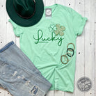 Lucky Gold Cheetah Shamrock short sleeve graphic tee by The Graphic Tee, featuring a vibrant cheetah and shamrock design.
