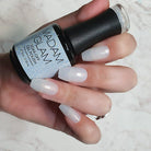 Madam Glam "Am I Clear?" nail polish bottle with clear glass and white cap, showcasing the transparent nail polish inside.
