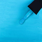 Madam Glam Aqua Shine nail polish bottle with bright blue color and shiny finish, showcasing the vibrant nail polish product.