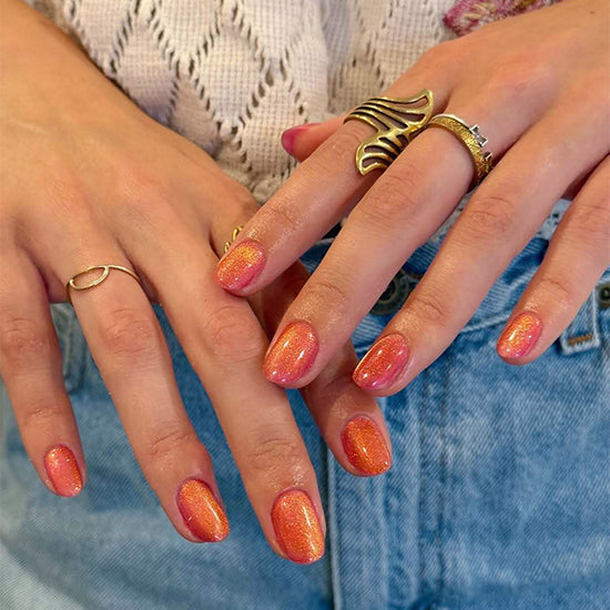 Madam Glam Cafeteria Crush nail polish bottle with vibrant orange shade and modern packaging design.