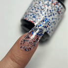 Madam Glam fireworks-themed nail polish display with vibrant, colorful fireworks design on the nail art.