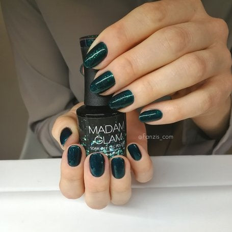 Shimmering emerald glitter nail polish bottle by Madam Glam with a sparkly green finish.
