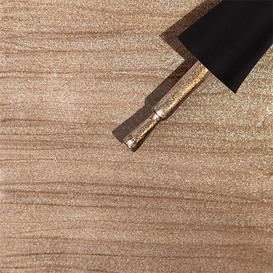 Madam Glam Harvest Glow nail polish bottle with a vibrant, shimmering orange and gold finish, showcasing a luxurious gel manicure.