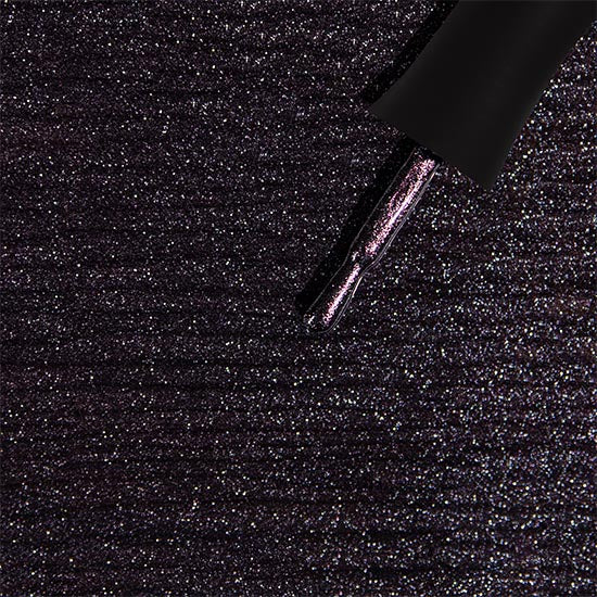 Madam Glam Haunted Velvet nail polish bottle with dark velvet finish and black cap, showcasing luxurious, deep purple color.