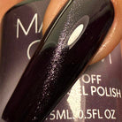 Madam Glam Haunted Velvet nail polish bottle with dark velvet-colored polish and sleek black cap.
