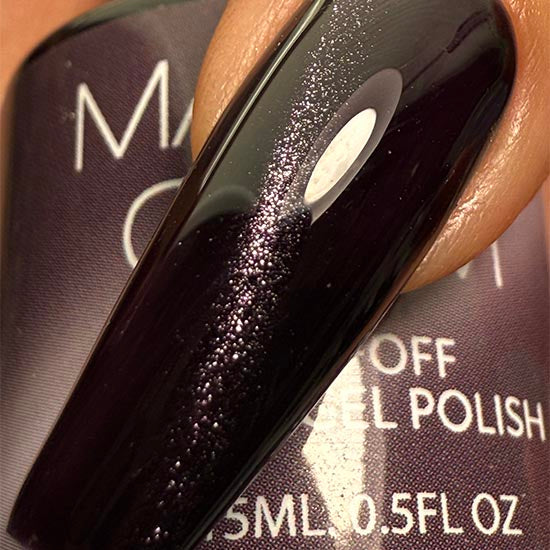 Madam Glam Haunted Velvet nail polish bottle with dark velvet-colored polish and sleek black cap.