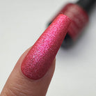 Madam Glam Heart Glow nail polish with a shimmering pink heart-shaped design on a clear base.