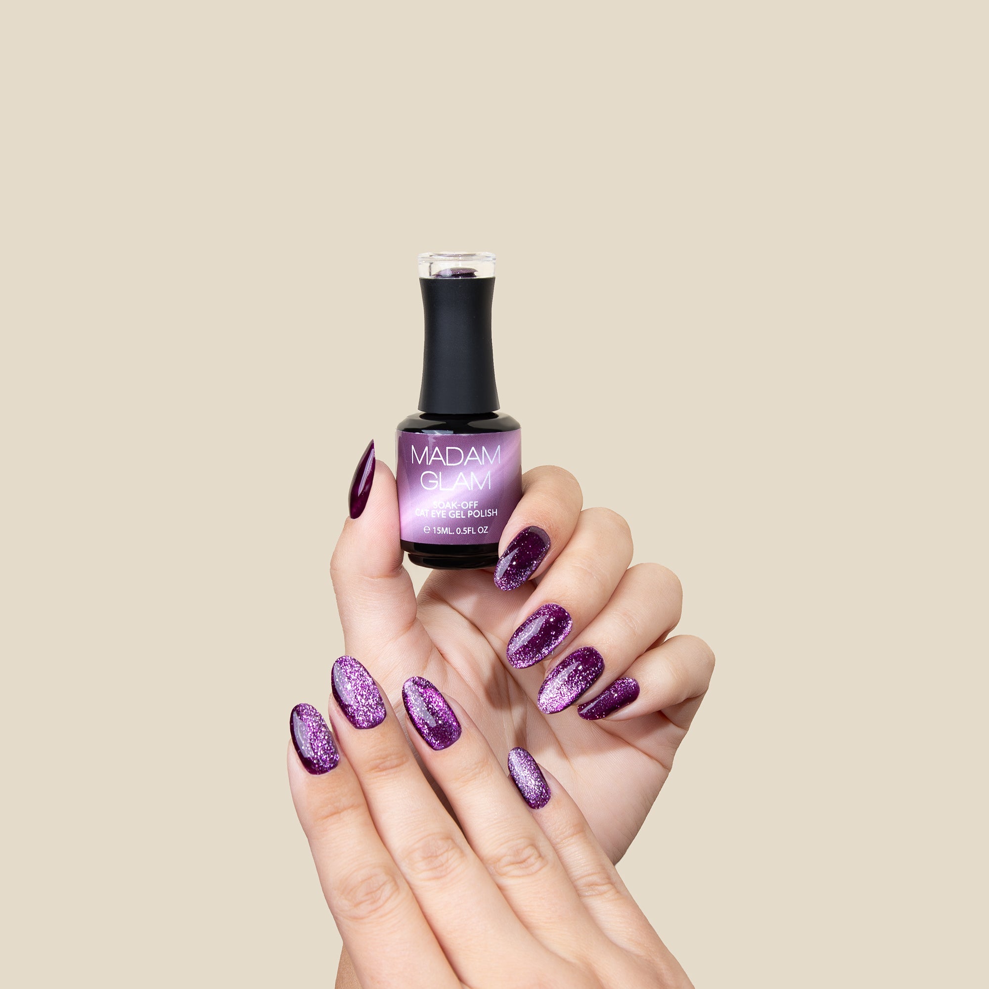 Madam Glam Hocus Plum gel nail polish bottle with purple and pink shades on a white background