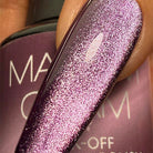Madam Glam Hocus Plum nail polish bottle with purple-colored polish and sleek packaging, close-up shot.