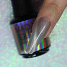 Holographic Cat Eye nail polish by Madam Glam showcasing a shimmering, multi-dimensional cat eye effect on a nail.