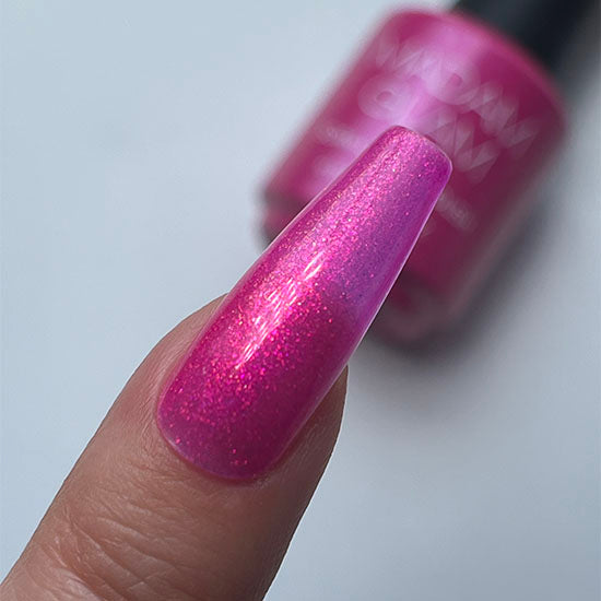 Madam Glam Rose Glitz nail polish bottle with pink glittery nail polish and elegant packaging.
