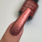 Scarlet Red nail polish bottle by Madam Glam showcasing vibrant red color and sleek packaging.