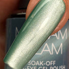 Madam Glam Serene Sky nail polish bottle with a soft sky blue cap and label, showcasing the product name and branding.