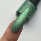 Madam Glam Shamrock Glow nail polish bottle with vibrant green nail polish and shiny finish on white background